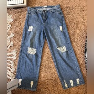 Medium Wash wide straight leg ripped jeans. Its also mid rise
